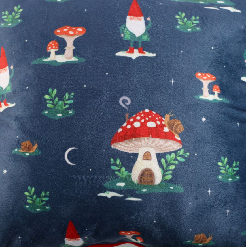 Square Gnome Print Cushion with Pom Poms close up showing snails mushroom houses and gnomes on a velvet navy background with stars