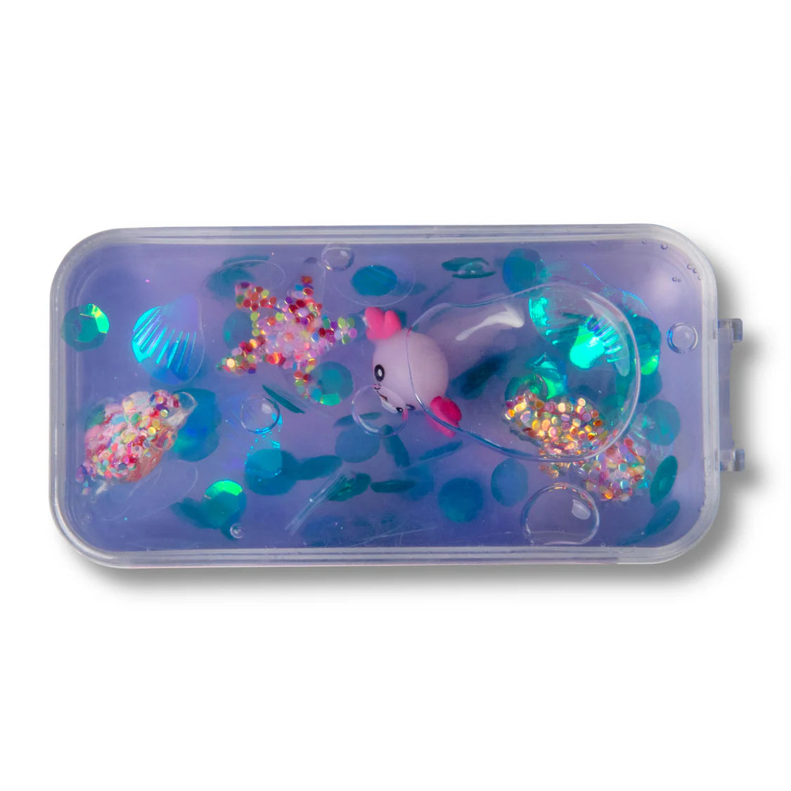 Clear container with colorful glitter and a small toy on a white background