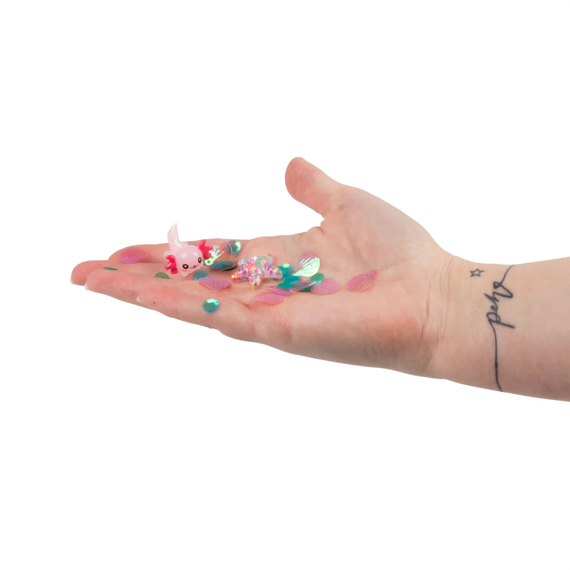 Hand holding colourful slime on a white background
