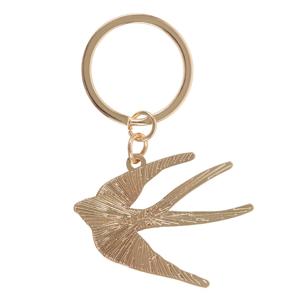 Gold bird-shaped keychain on a white background