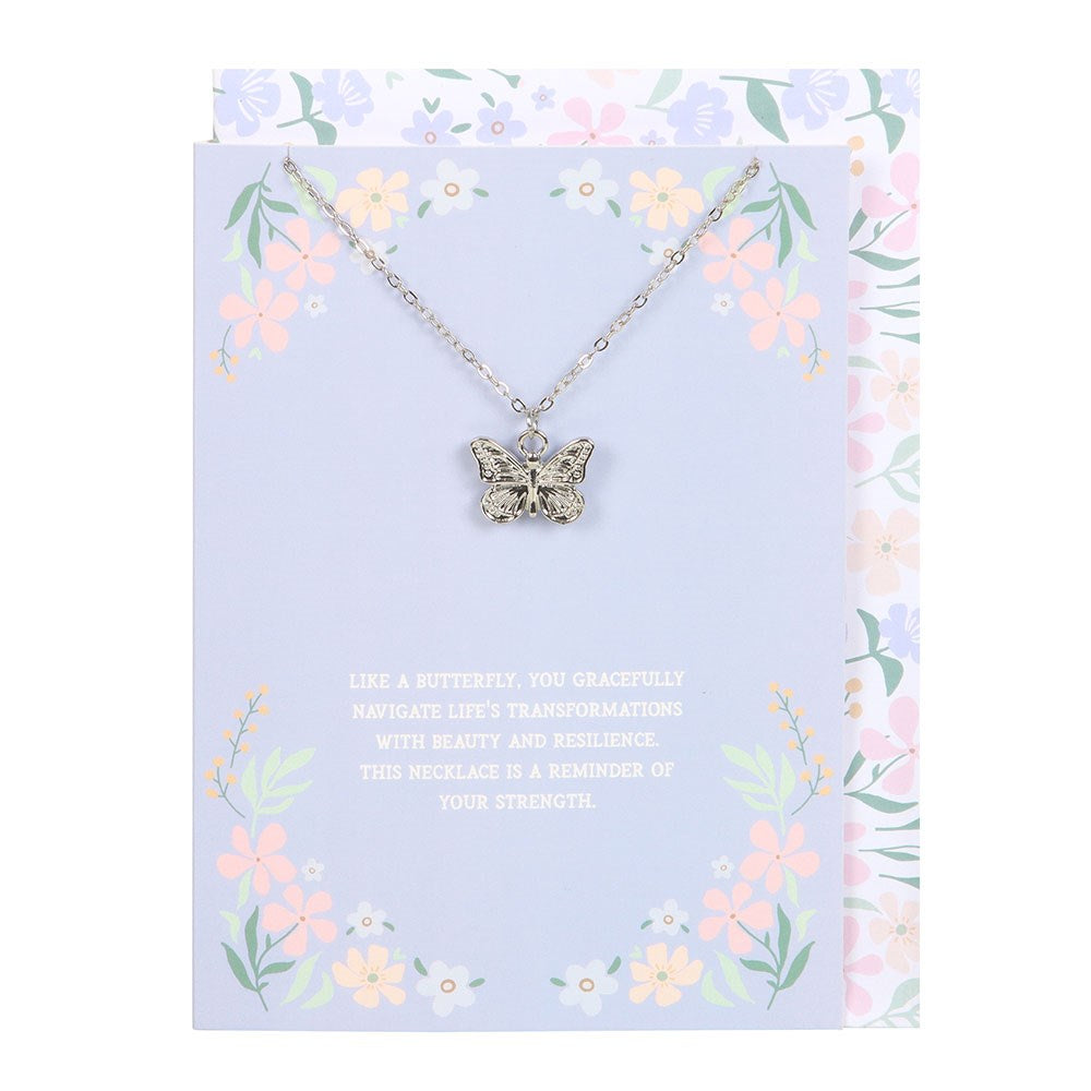 Butterfly necklace on a floral card with text