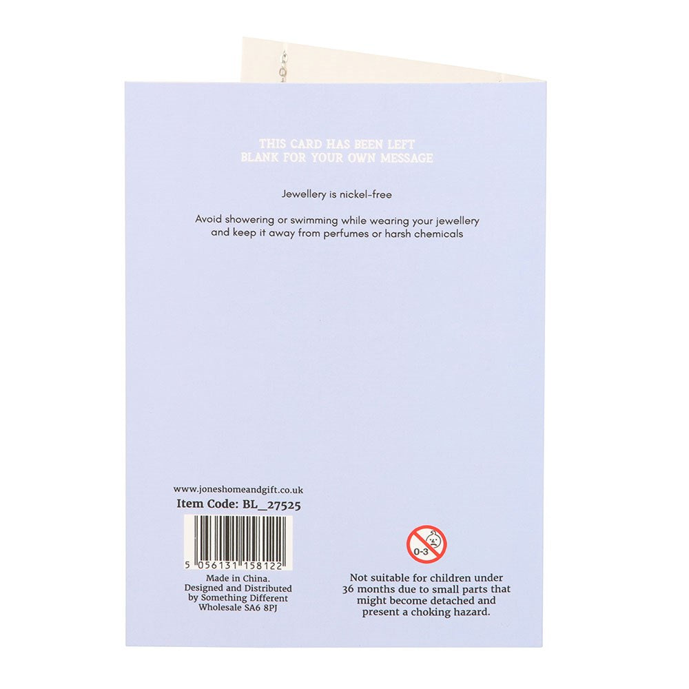 Back of a card with text and a barcode on a light purple background