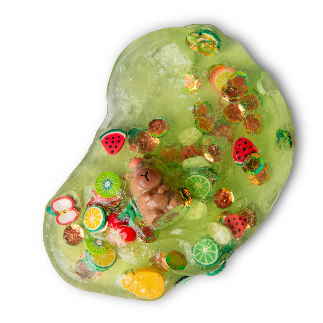 Green slime with fruit-themed toys and candies on a white background