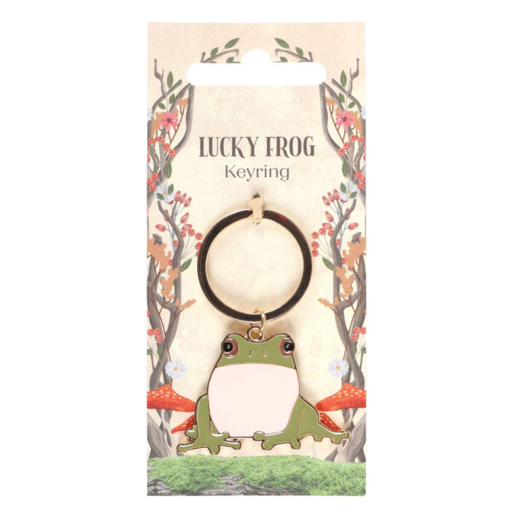 green and white enamel frog keyring on display card