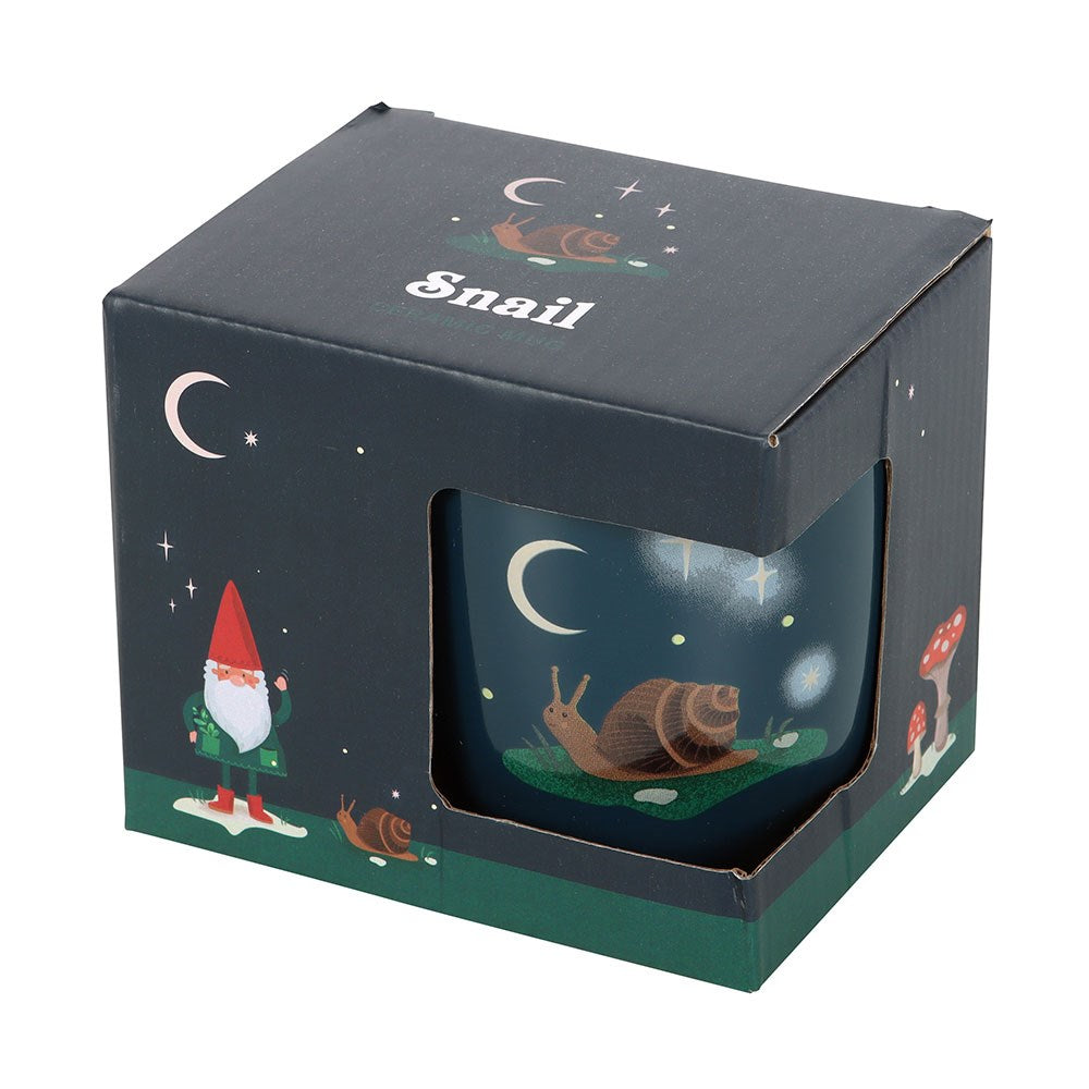 Decorative mug with a snail design in a matching box on a white background