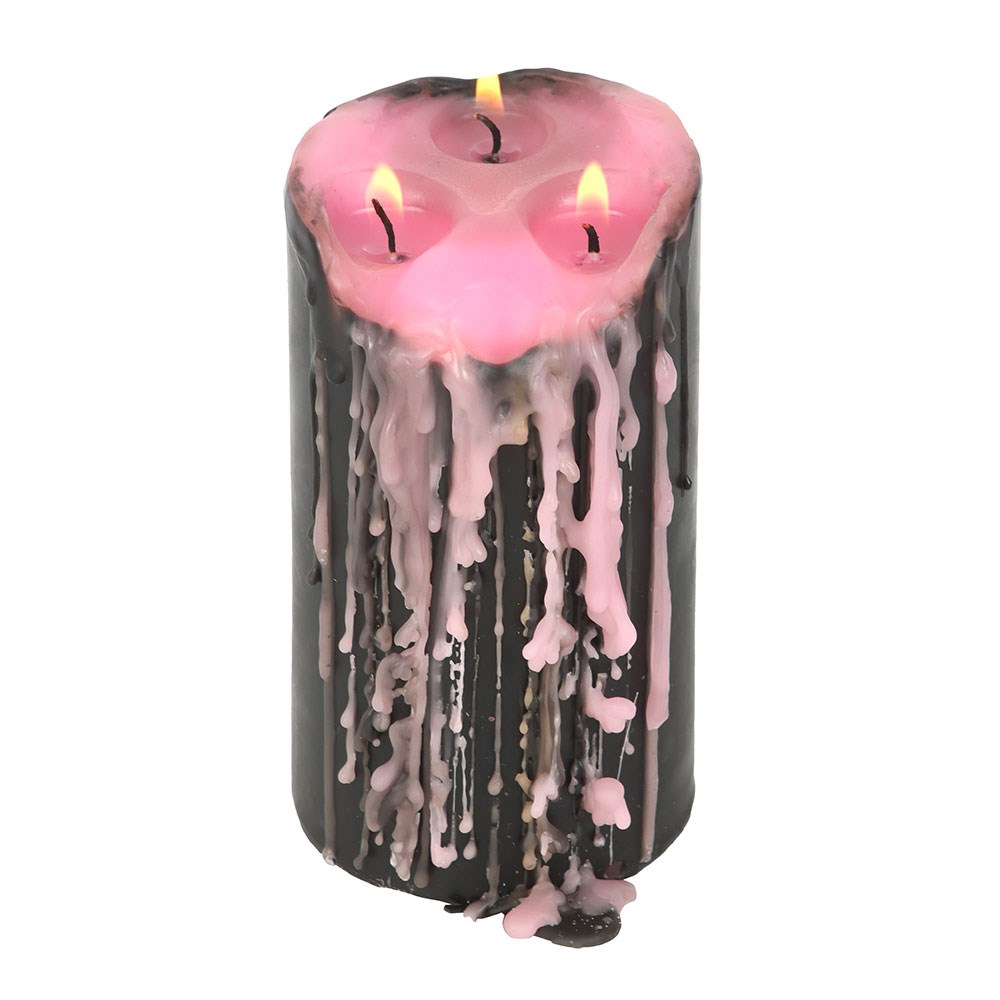 Large Pink Vampire Tears Pillar Candle black candle with internal pink wax lit