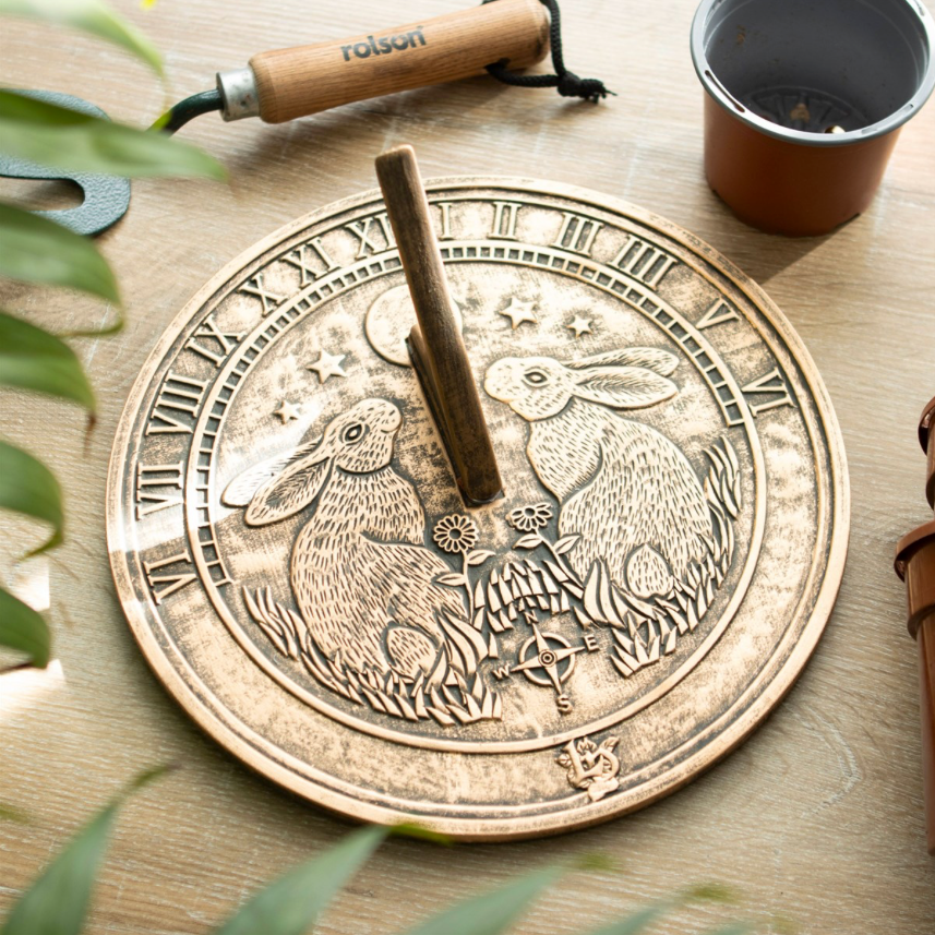 Moon Gazing Hare Terracotta Sundial by Lisa Parker on table