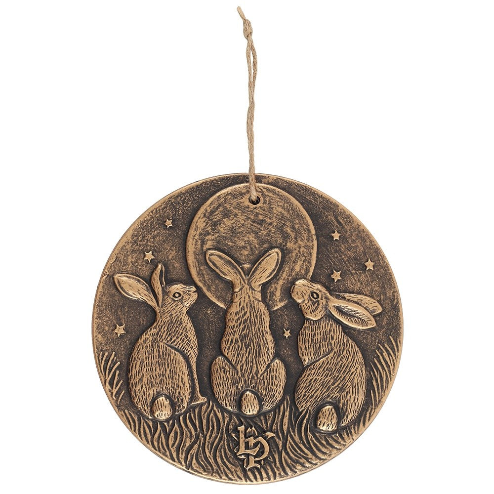 terracotta Bronze effect plaque with three rabbits looking up at a moon design