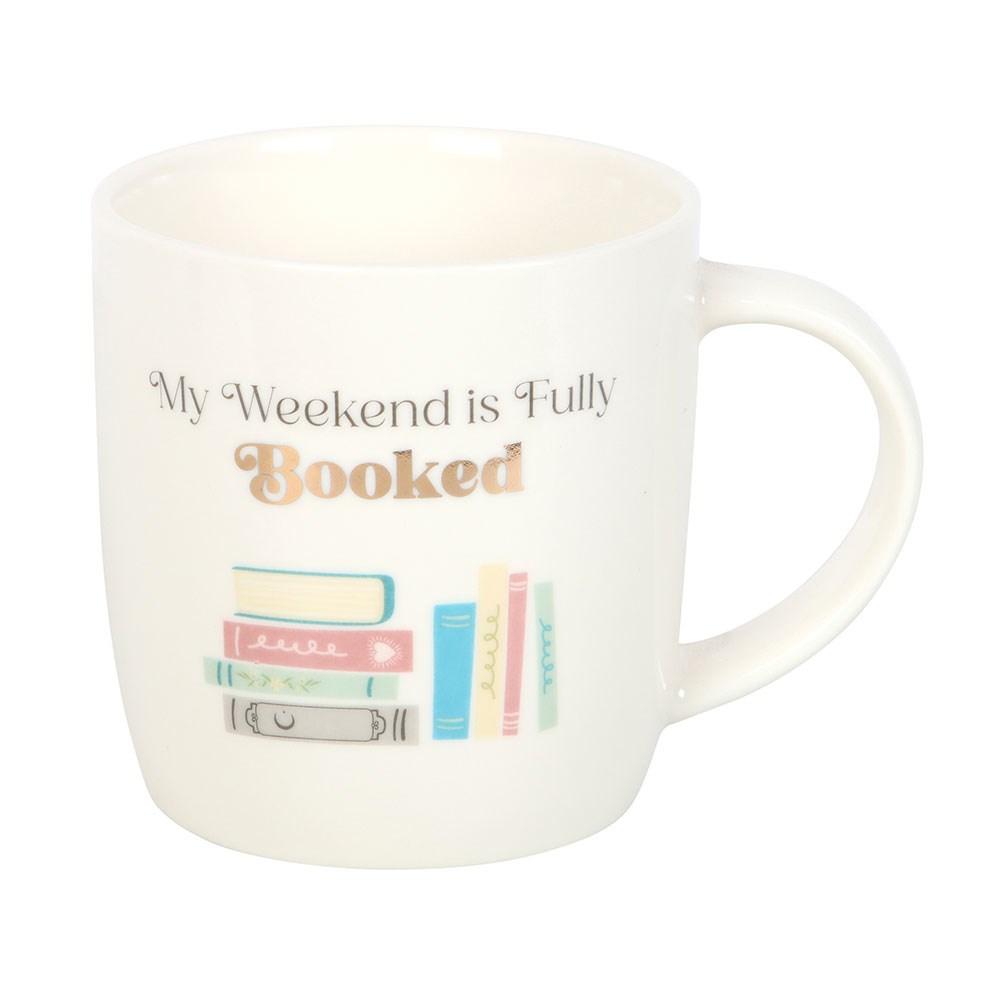 White mug with 'My Weekend is Fully Booked' text and book illustrations on a white background