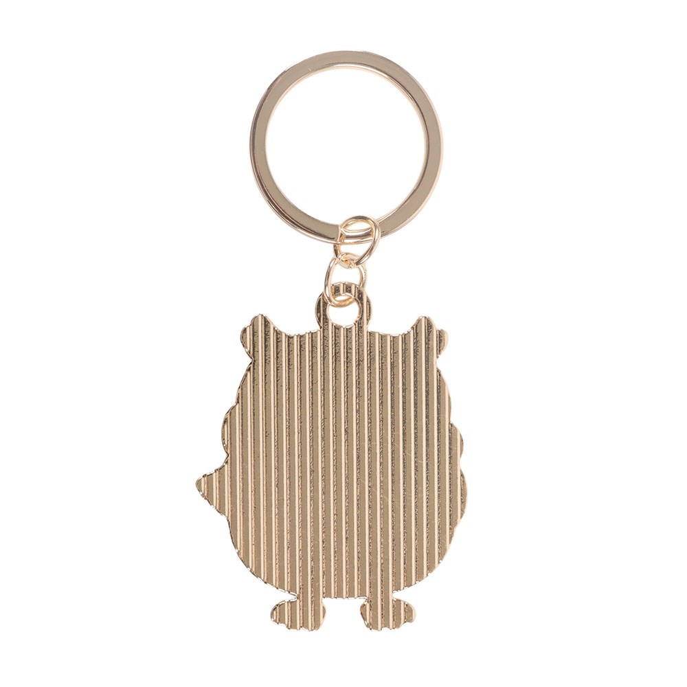 Gold keychain with a textured design on a white background