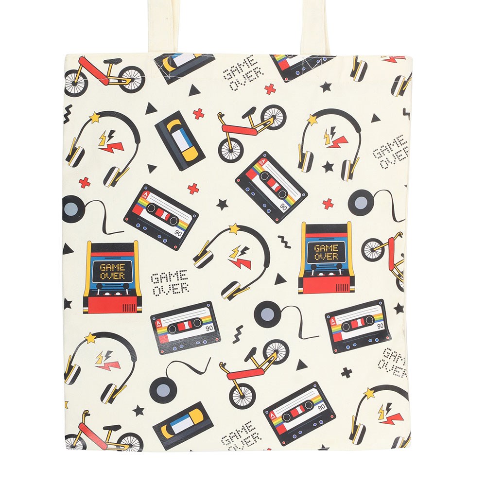 Tote bag with retro-themed design featuring cassette tapes, bikes, and 'Game Over' text on a cream background.