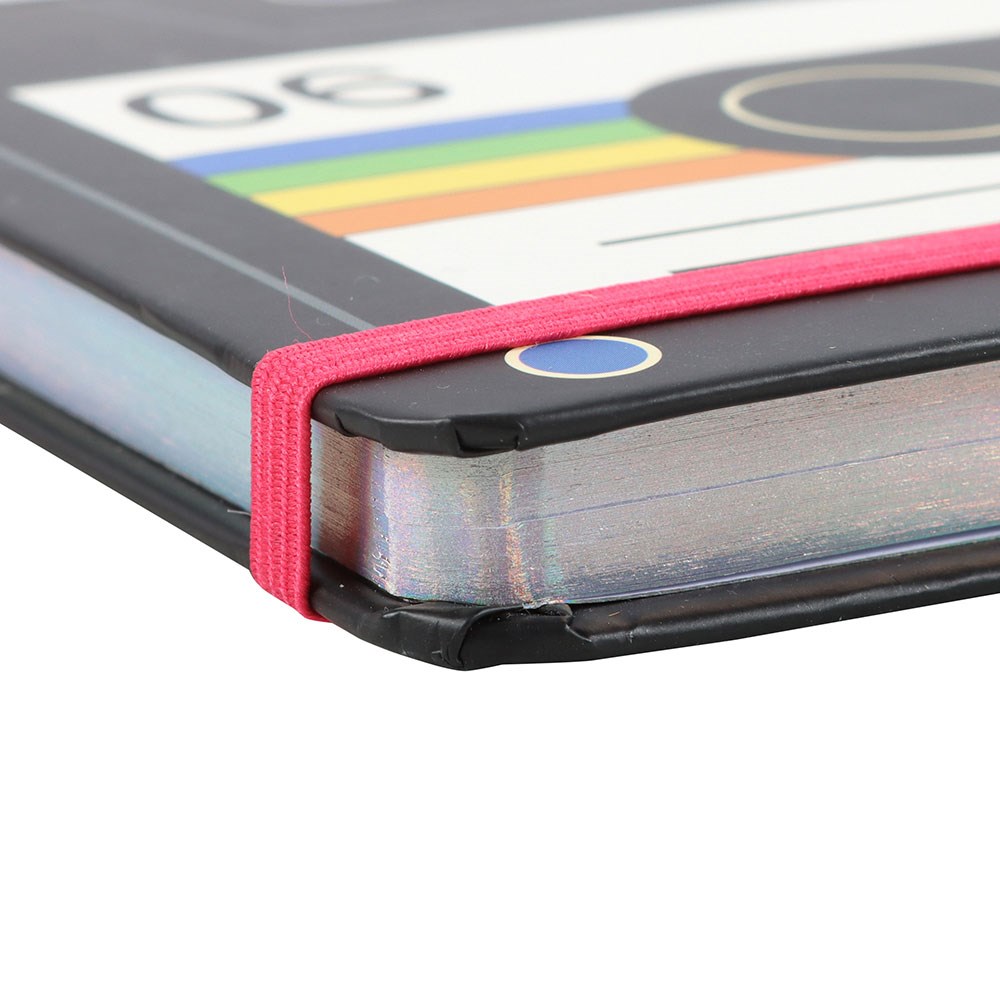 Close-up of a cassette tape note book with a red strap on a white background