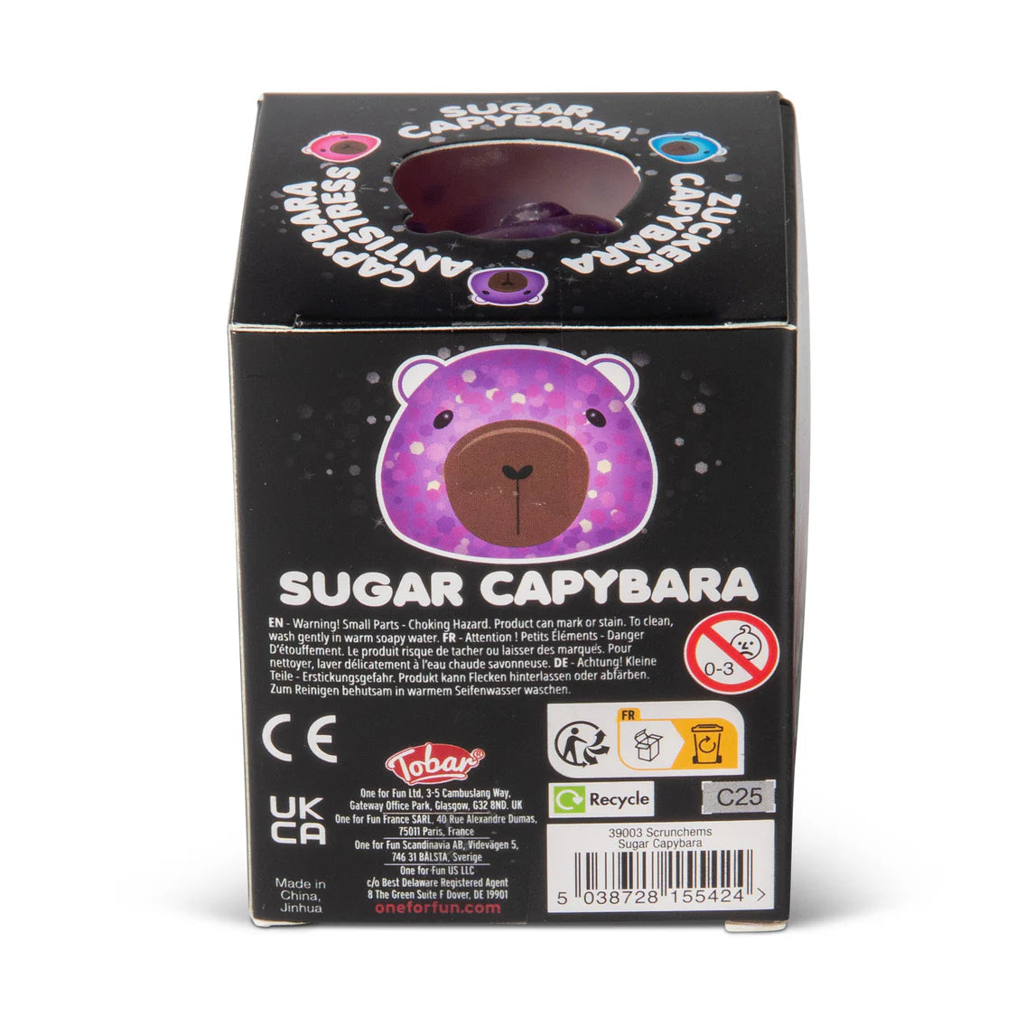 Black packaging box for a toy with a purple circle featuring a capybara and text on a white background