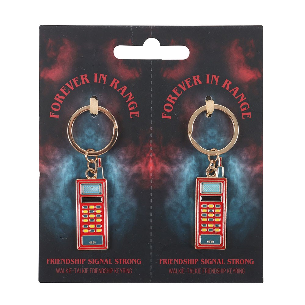 Two red phone-shaped keychains on a 'Forever in Range' branded card with a dark, abstract design.