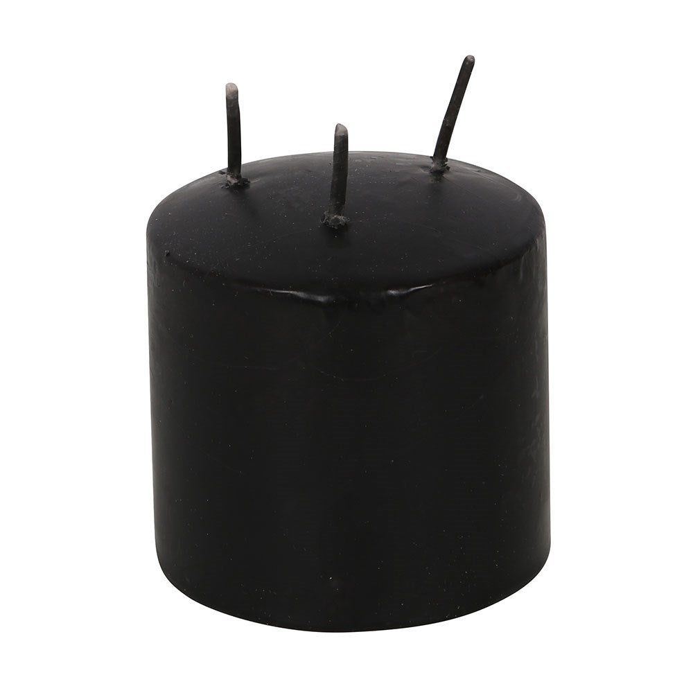 Small Pink Vampire Tears Pillar Candle black candle with pink wax inside when lit