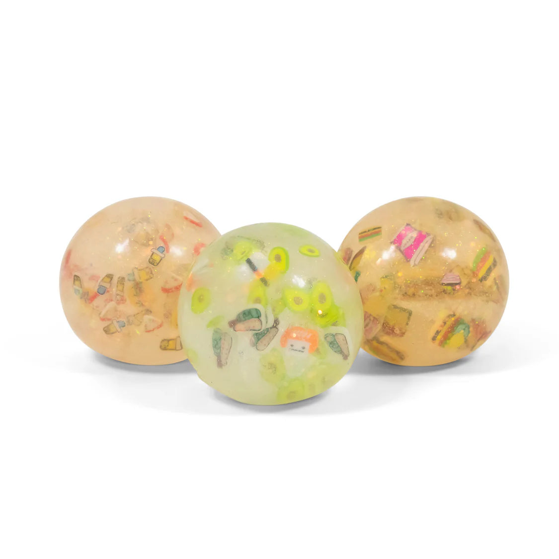 Three transparent balls with colorful stickers on a white background