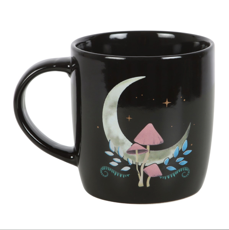 Dark Forest Mushroom Moon Mug a black mug with white crescent moon and pink mushrooms side view