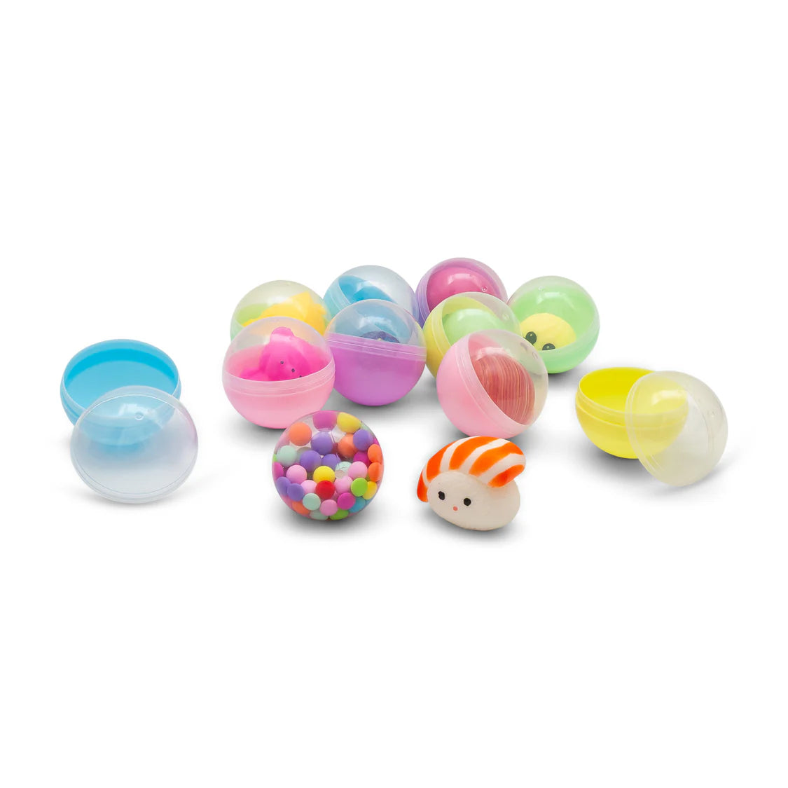 Colorful plastic toys resembling eggs on a white background