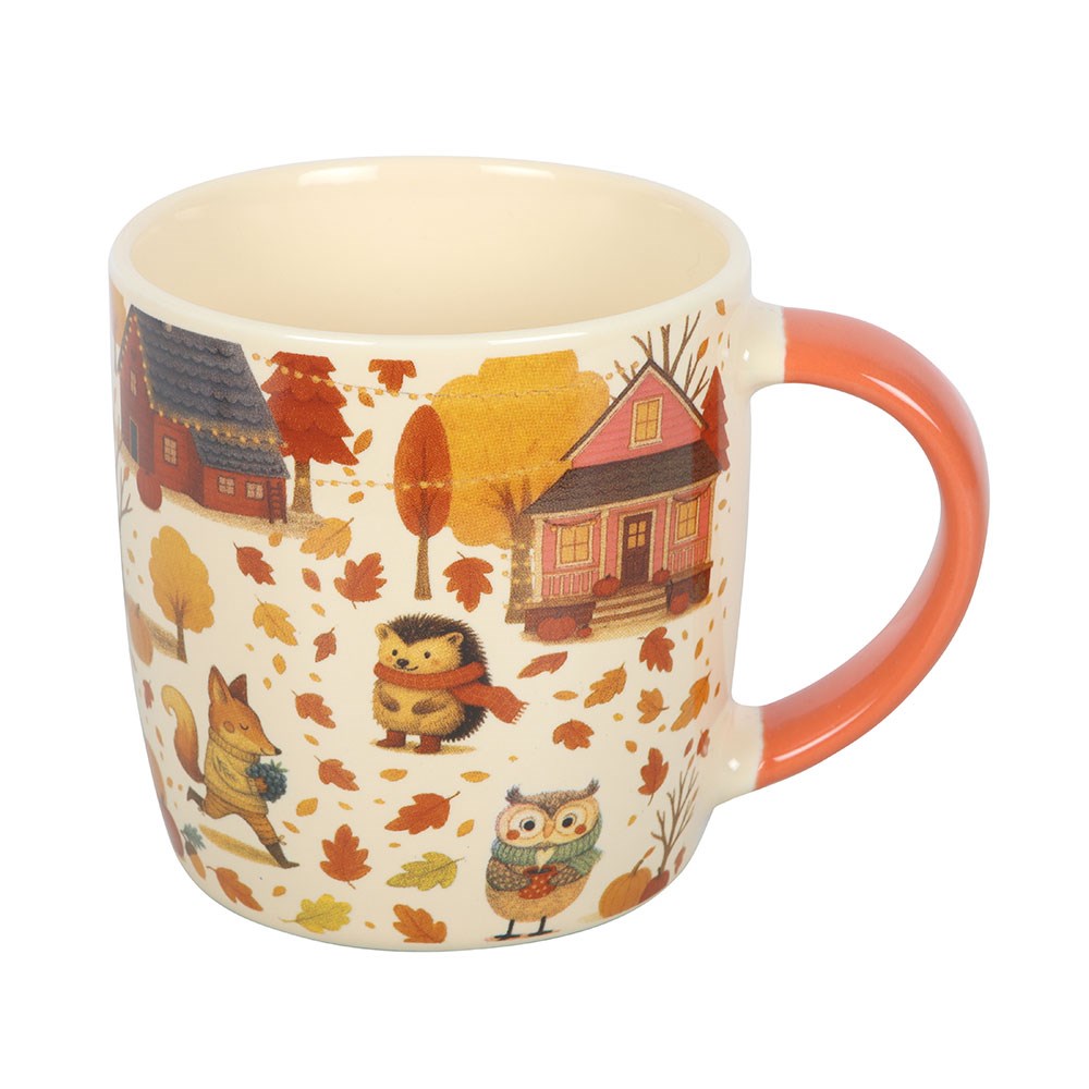 Mug with autumn-themed design featuring houses, animals, and leaves on a white background