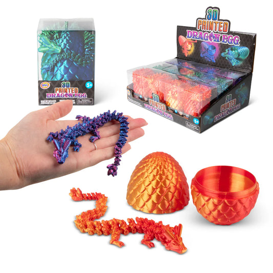 3D printed dragon egg toy set with packaging and a hand holding a small dragon model.