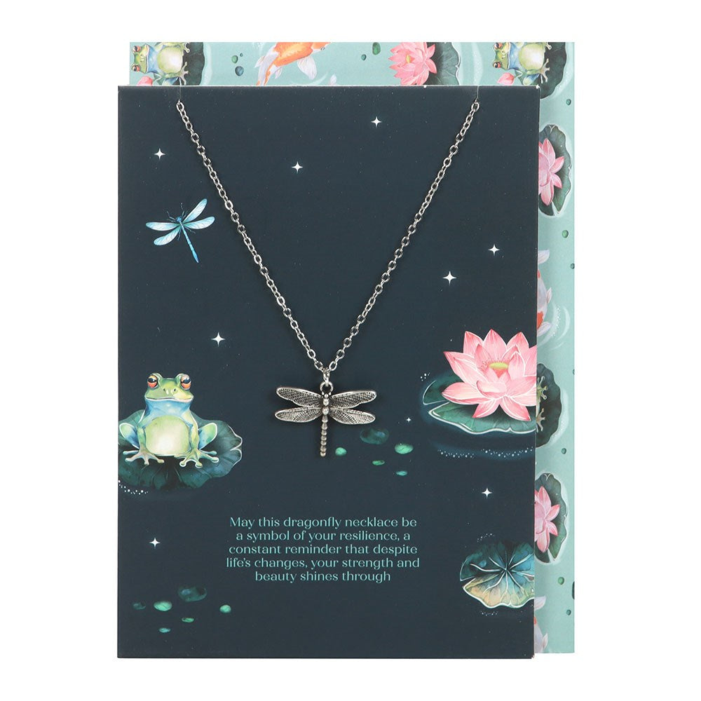 Dragonfly necklace on a decorative card with frog and lotus design