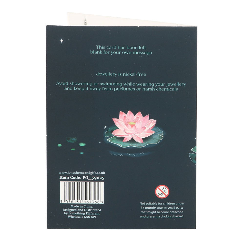 Back of a jewelry card with pink lotus flower illustration and text