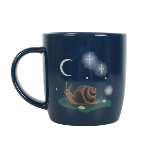 Navy blue mug with a snail and celestial design on a white background