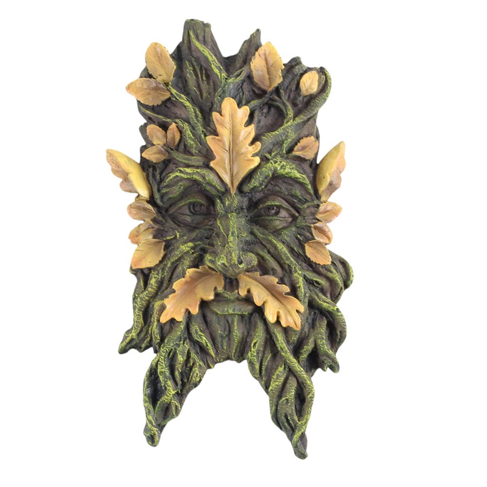 Greenman mask with leafy design on a white background