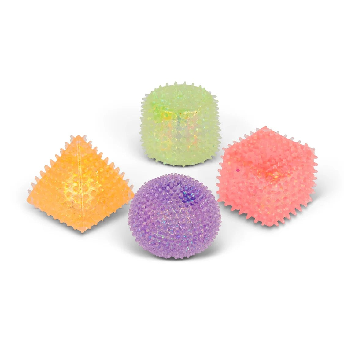 Four textured, spiky stress Scrunchems Sensory Sugar Shapes in orange, light green, pink, and purple, arranged on a clean white background.
