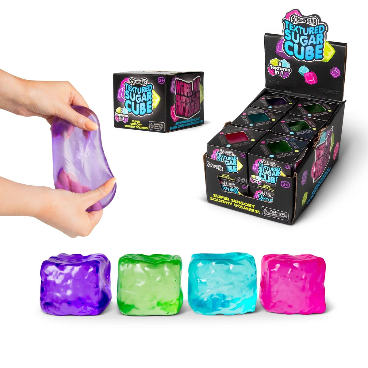 Colorful textured  Scrunchems Sugar Cubes with packaging and a hand holding one cube.