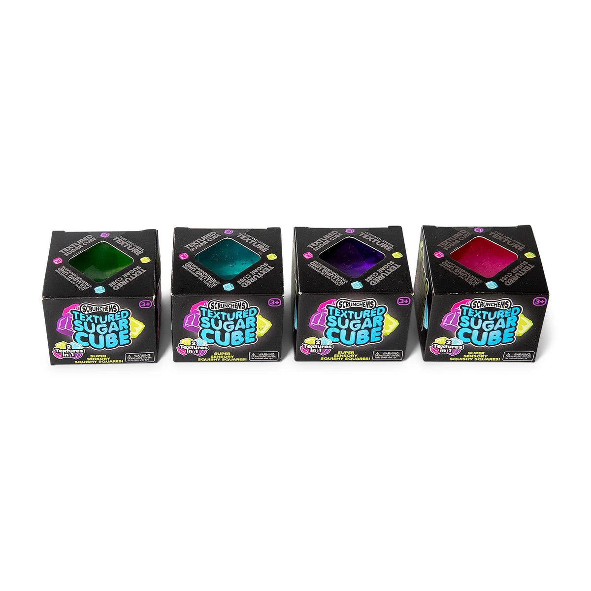 Four small black boxes of Scrunchems Sugar Cube in different colours (green, blue, purple, and pink) arranged in a row on a white background.