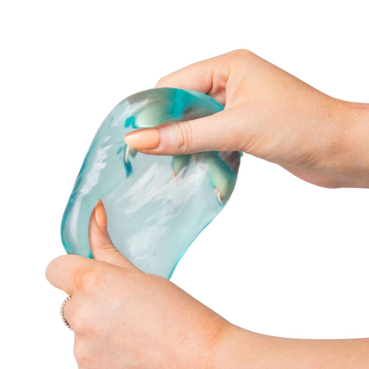 Hand holding a blue Scrunchems Sugar Cube against a white background