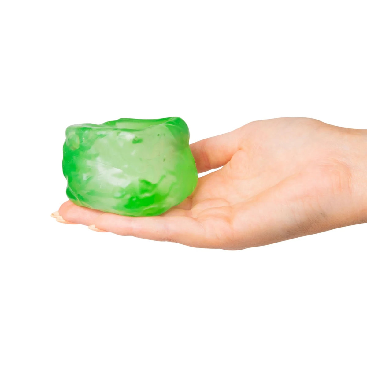 Green Scrunchems Sugar Cube held in a hand against a white background