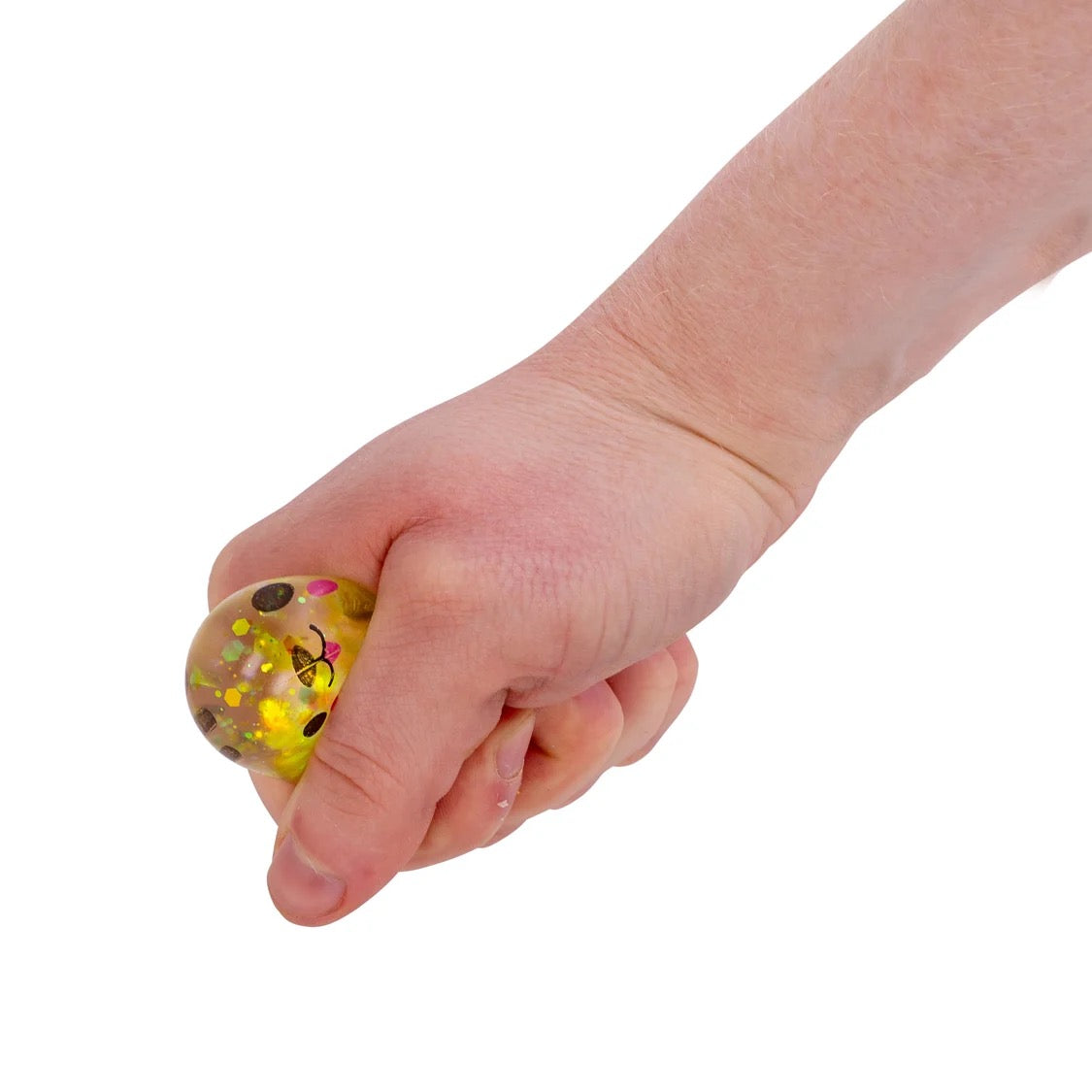 Hand holding a small, round, multicoloured Scrunchems Sugar Squishy Kitties against a white background