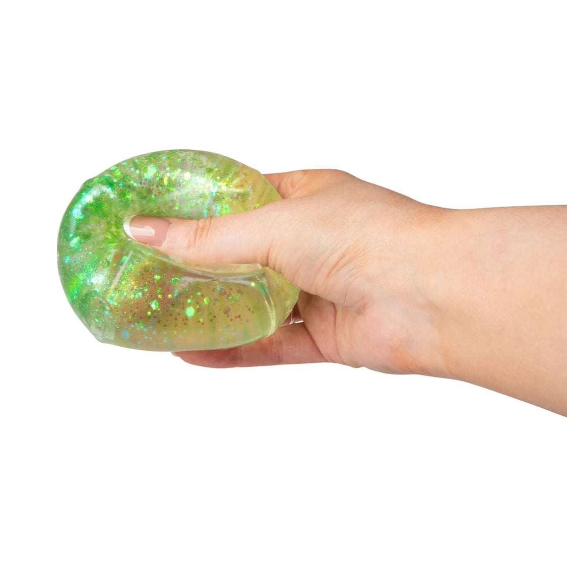 Hand holding a green Scrunchems Glitter Cube against a white background