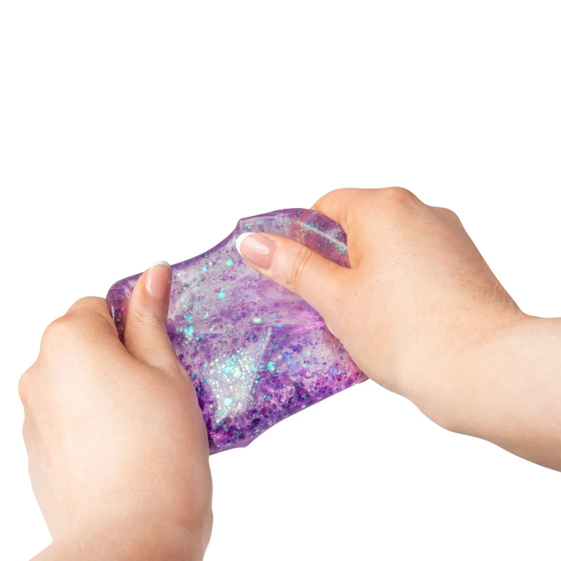 Hand holding a glittery purple Scrunchems Glitter Cube against a white background