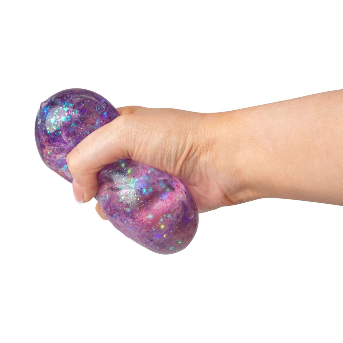 Hand holding a purple Scrunchems Glitter Cube against a white background