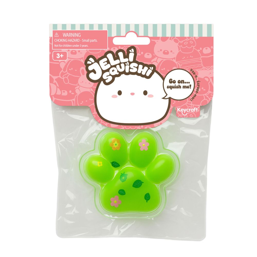 Green paw-shaped squishy toy in packaging with Jelli Squishi branding.