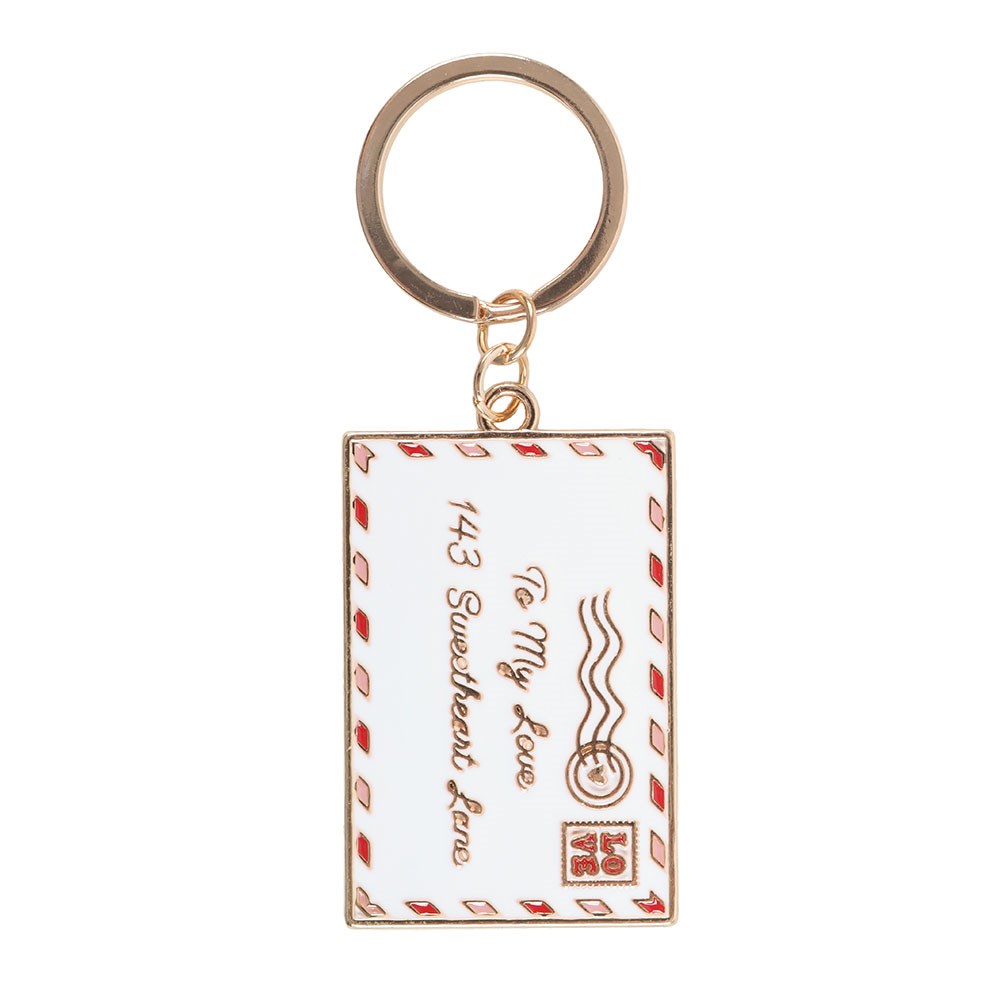Keychain with a design resembling an envelope and text on a white background