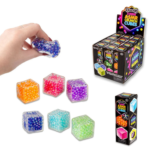 Colorful ASMAR Crunch Cubes with packaging and a hand holding one cube.