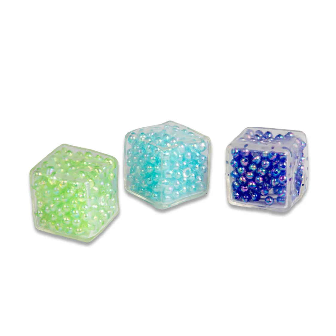 Three ASMR Crunch cubes filled with colourful beads on a white background
