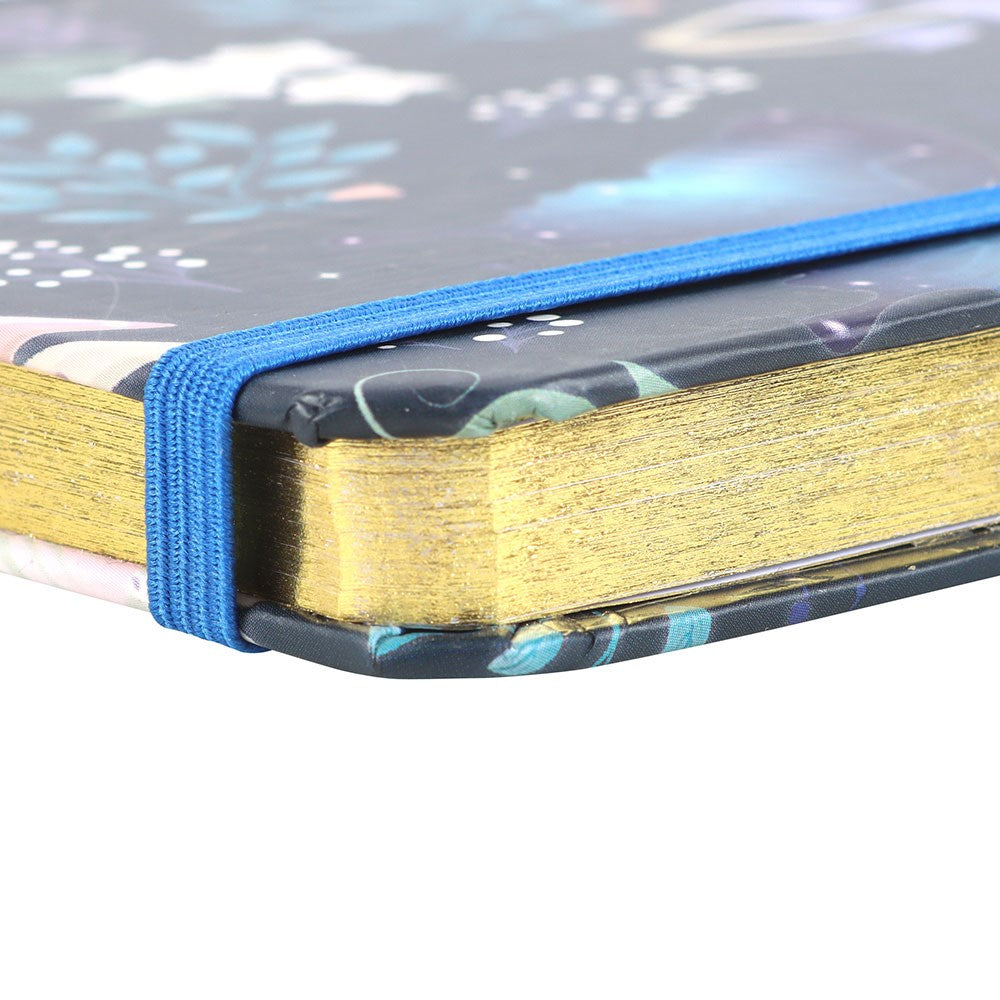 Close-up of a book with a blue ribbon marker on a blurred background