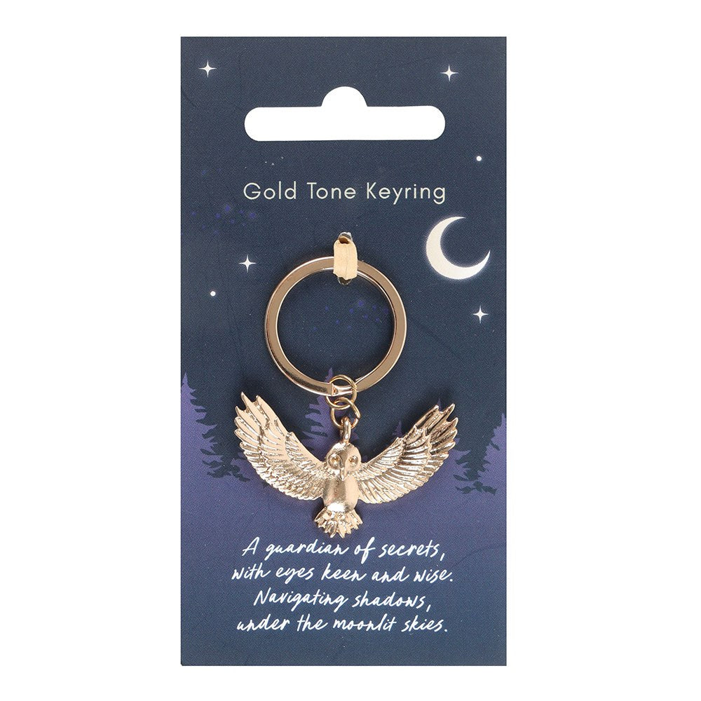 Gold tone keyring with owl charm on a blue card with celestial design