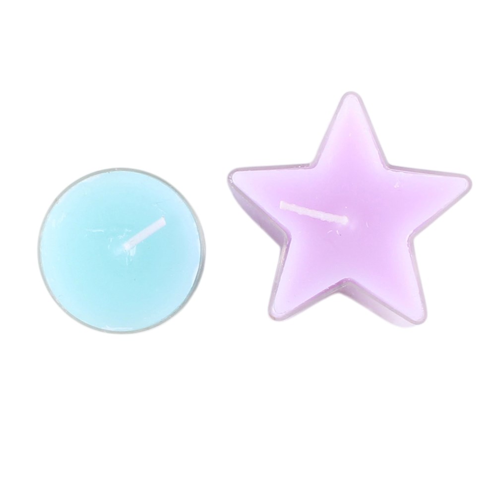 Two small candles on a plain white background: a round tealight candle in light aqua blue and a star-shaped candle in pale lavender pink.