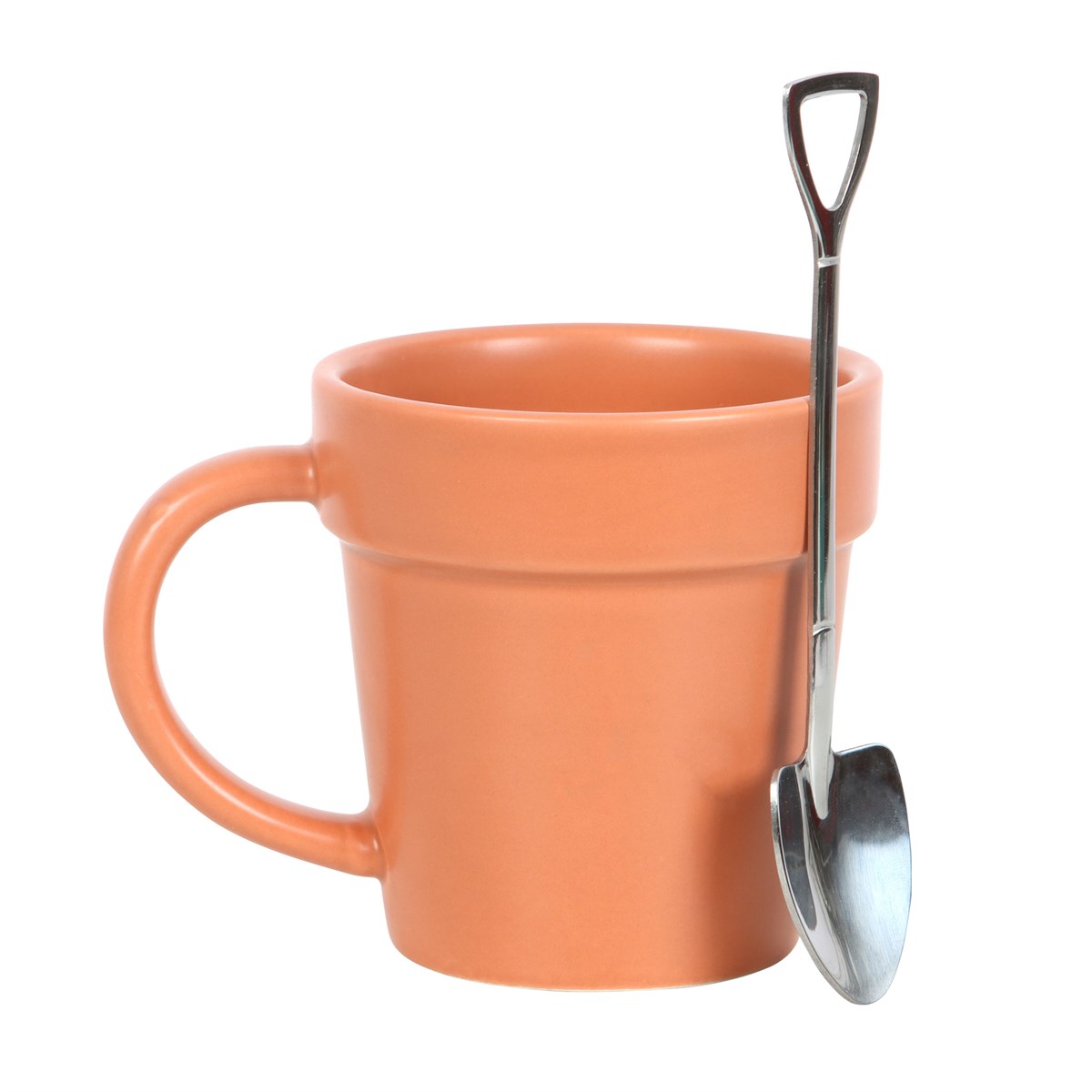 Terracotta-colored mug with a small metal shovel on a white background