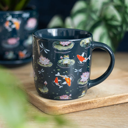 Pond Print Mug, adorned with vibrant lily pads, playful frogs, graceful dragonflies, blooming lilies, and colourful koi fish