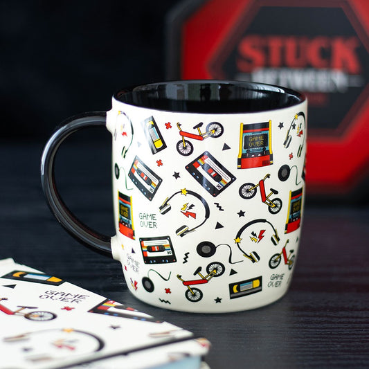 Mug with retro-themed design on a dark surface