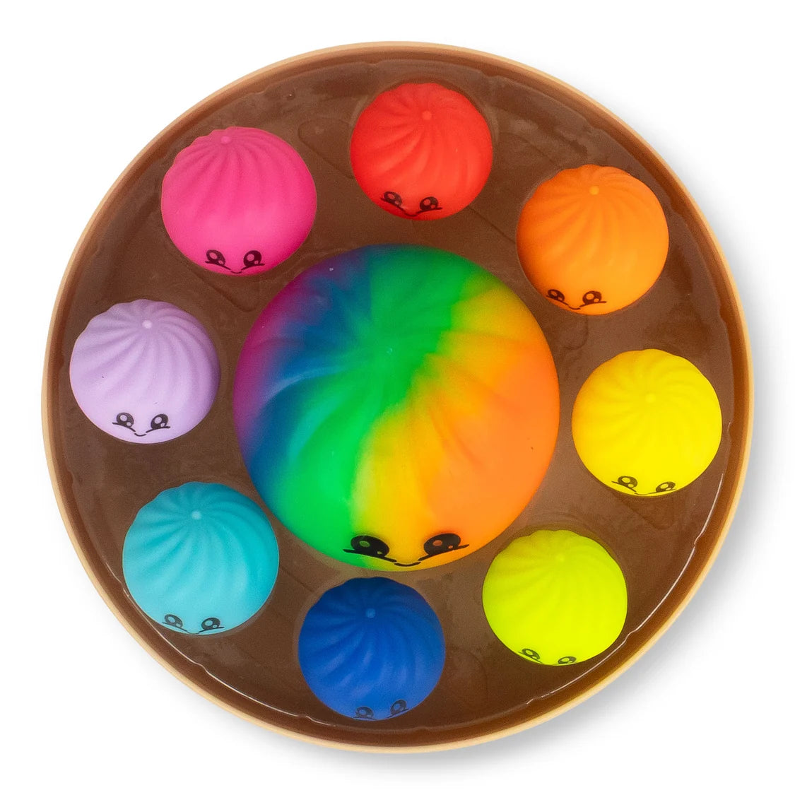 Colourful squishy dumplings with smiling faces in a brown plastic steamer box