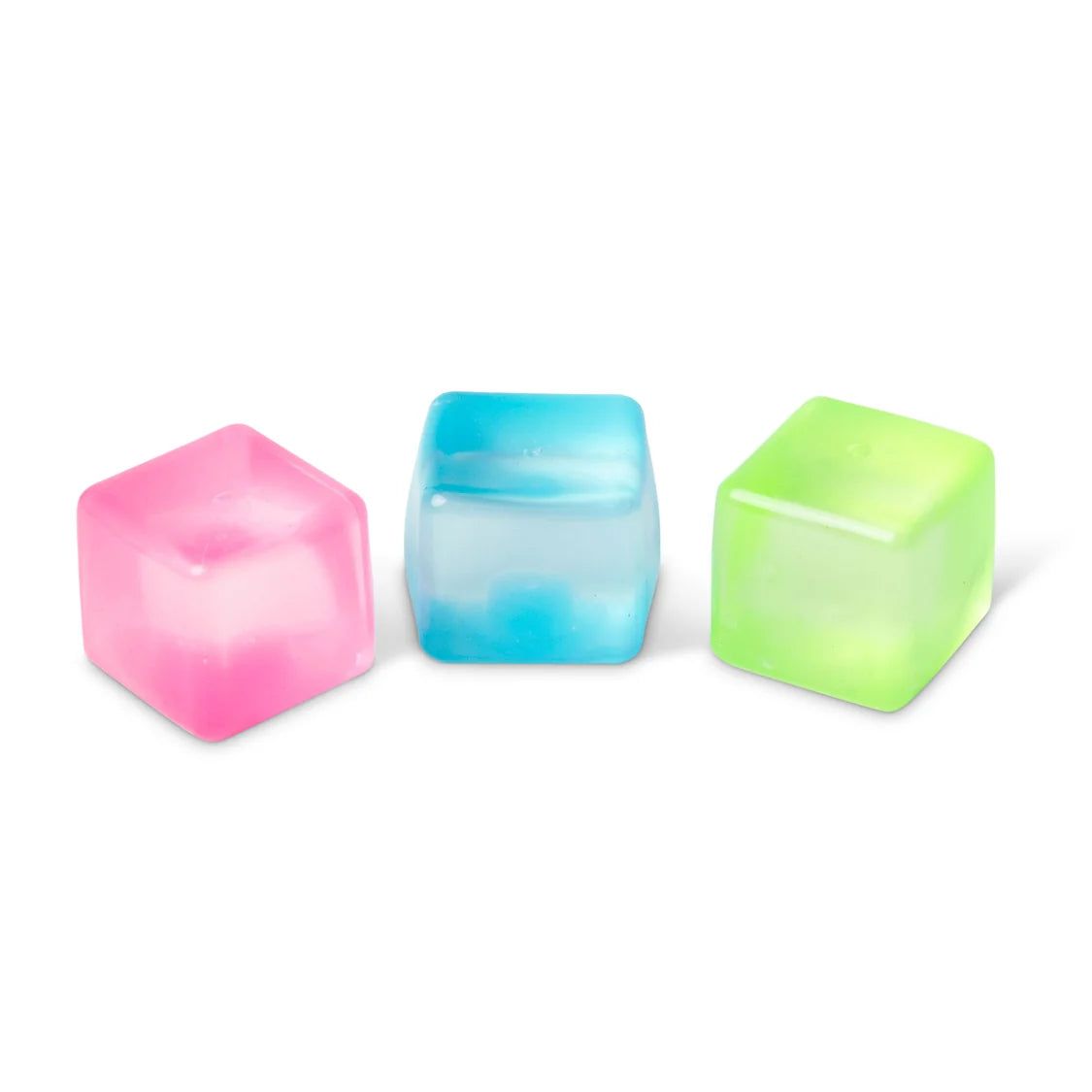 Three colourful sugar cubes (pink, blue, green) on a white background