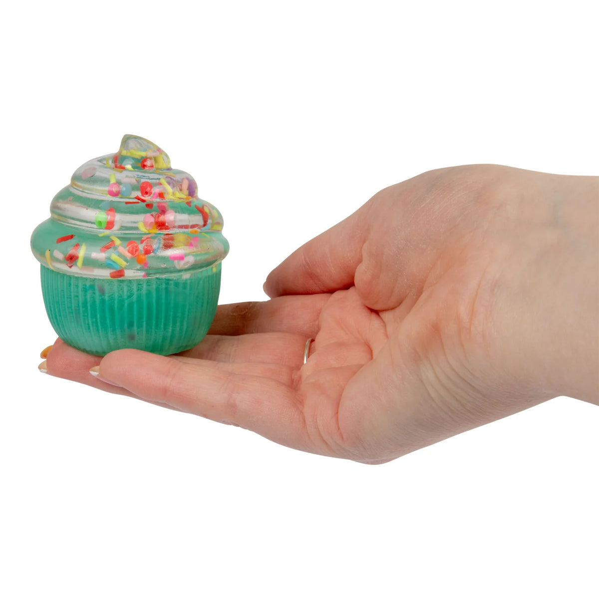 Hand holding a small Scrunchems Sugar Cupcakeon a white background
